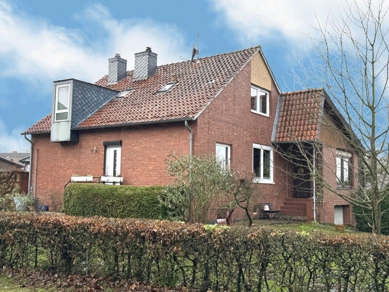 Wennigser Mark: Einfamilienhaus mit Wintergarten ähnlichem Anbau und großer Kellergarage in äußerst ruhiger Lage. 